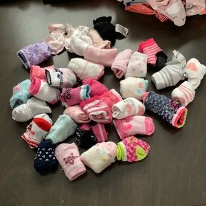 Baby girl socks and hand mittens